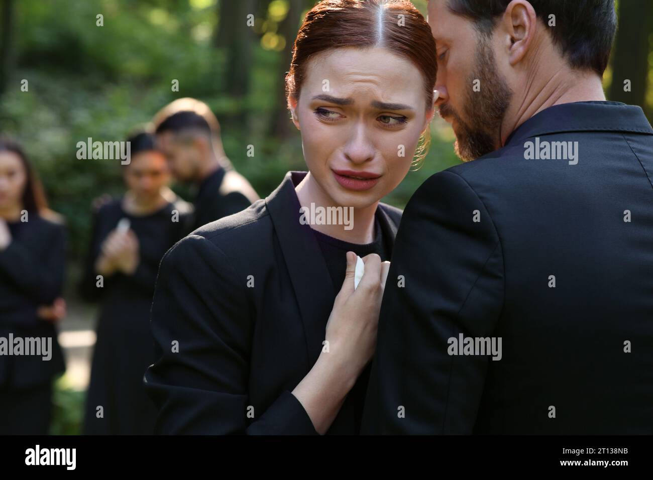 Sad people in black clothes mourning outdoors. Funeral ceremony Stock ...