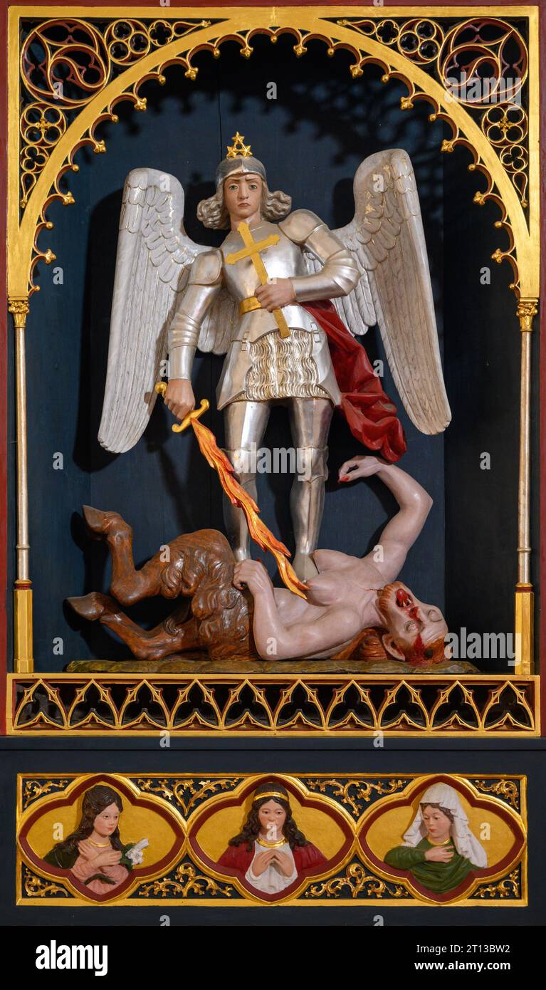 Saint Michael the Archangel defeating the Devil. The Church of the Holy Spirit in Ľubica, Slovakia. Stock Photo