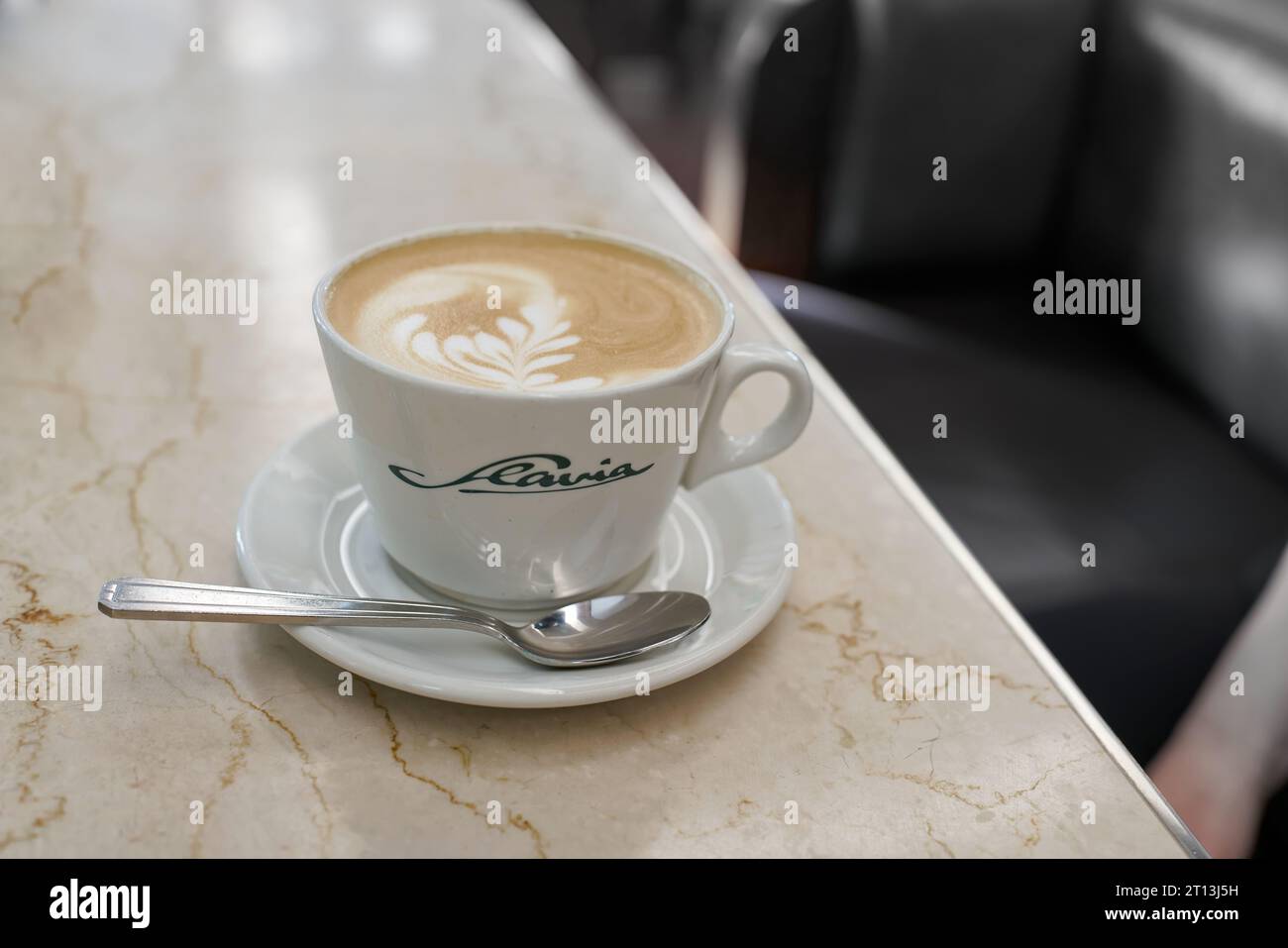 A cup of latte macchiato at the famous Cafe Slavia, the meeting place of artists and celebrities in Prague Stock Photo