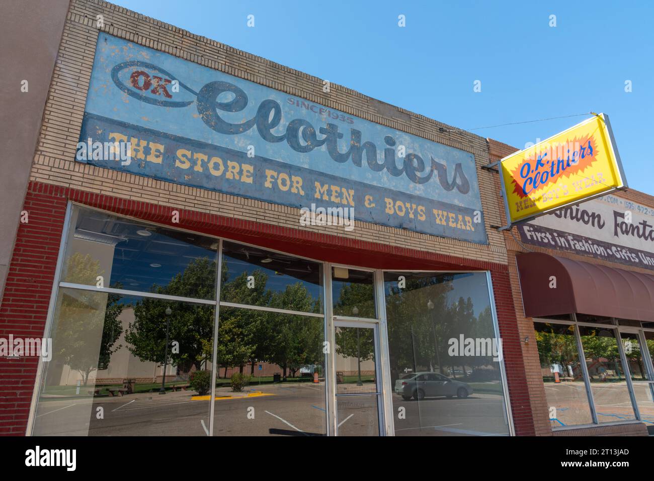 Storefront for O.K. Clothiers, a Gallegos family owned clothing store for men and boys, opened 1935, closed 2019, Santa Rosa, New Mexico, USA. Stock Photo