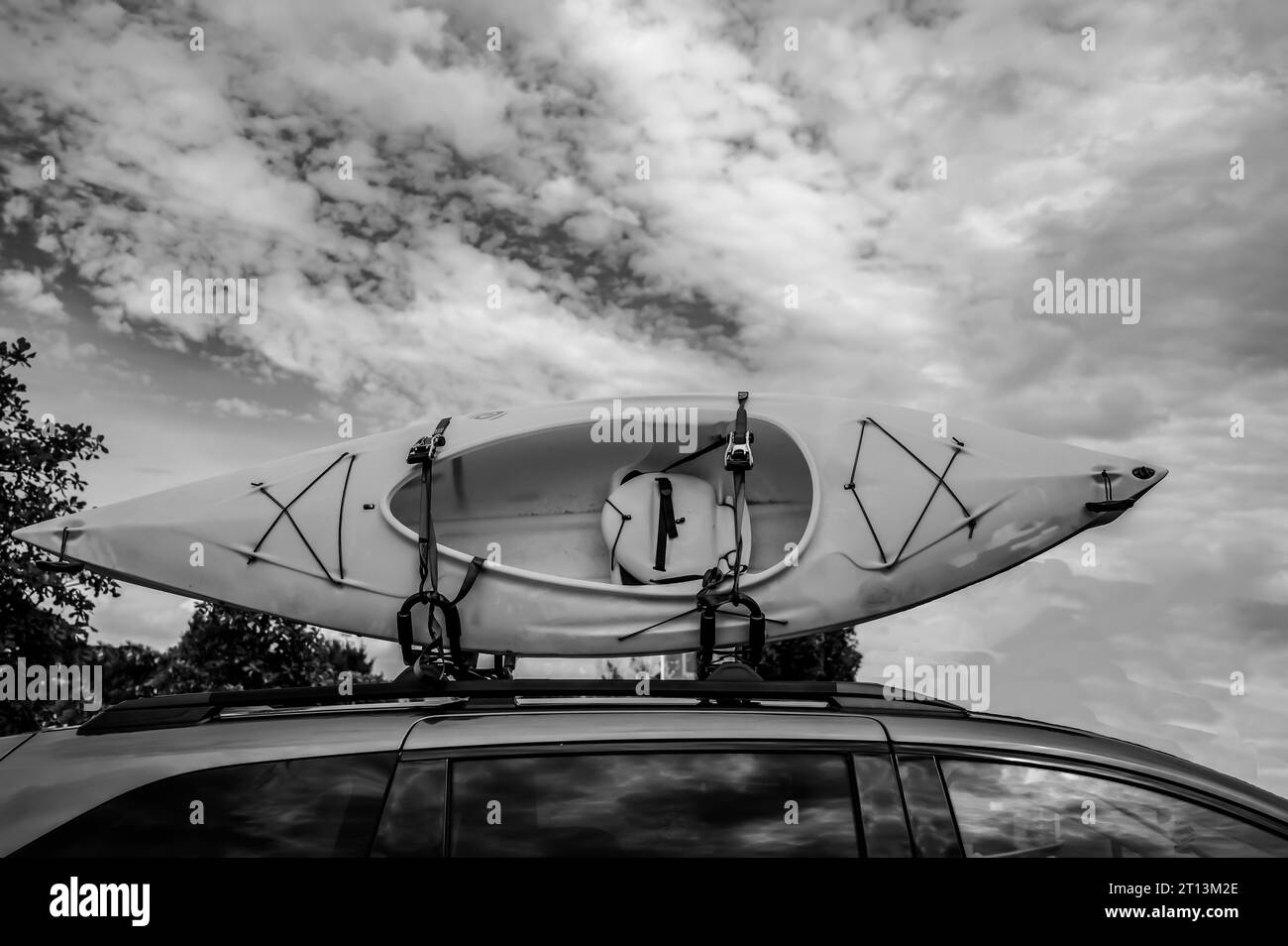 Roof mounted kayak on top of a van for transportation Stock Photo Alamy