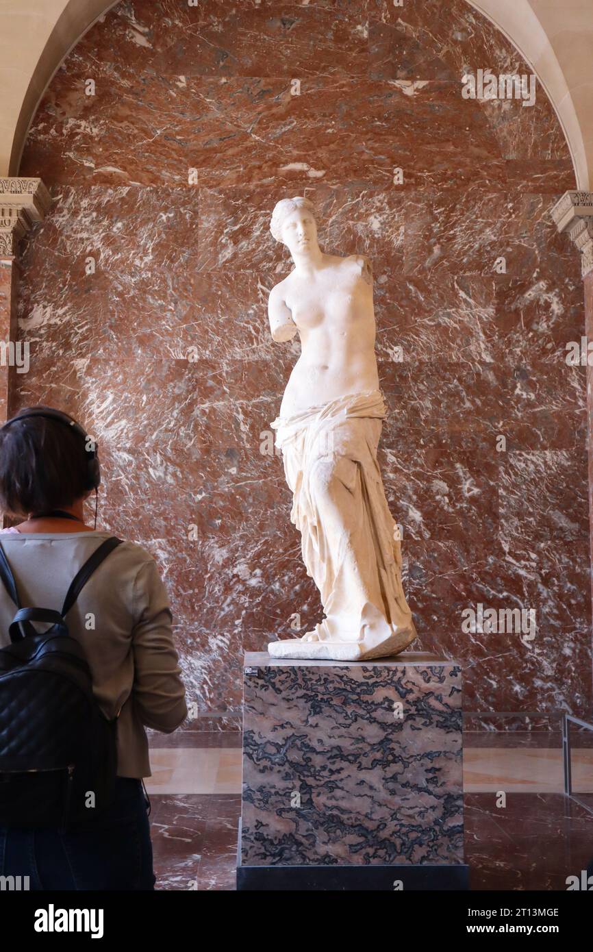 Venus de Milo Louvre. A tourist looking at Venus de Milo Statue, Louvre
