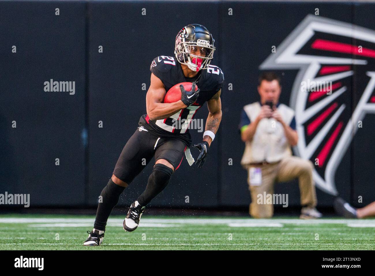 Atlanta Falcons cornerback Mike Hughes (21) runs the ball during the