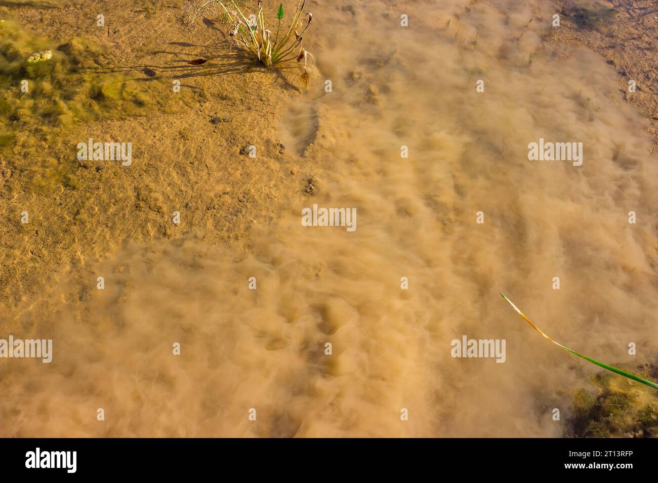 Mud raised from the bottom of a reservoir. Turbidity in the water in
