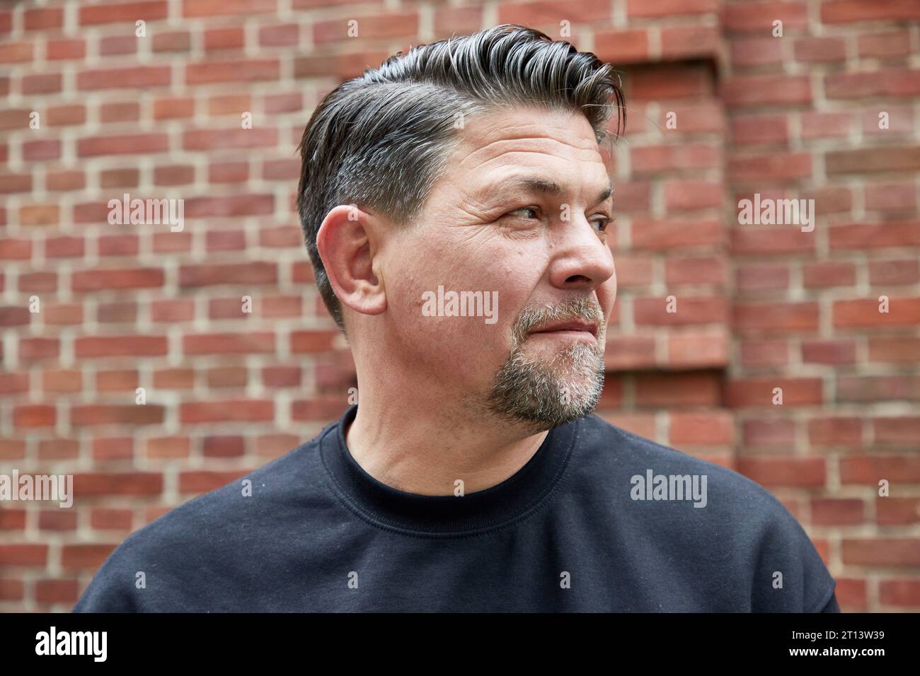 Hamburg, Germany. 18th Sep, 2023. Tim Mälzer, chef and author, stands in front of the restaurant 'Bullerei' on the occasion of an interview about his new book and the situation of pubs in Hamburg. Credit: Georg Wendt/dpa/Alamy Live News Stock Photo