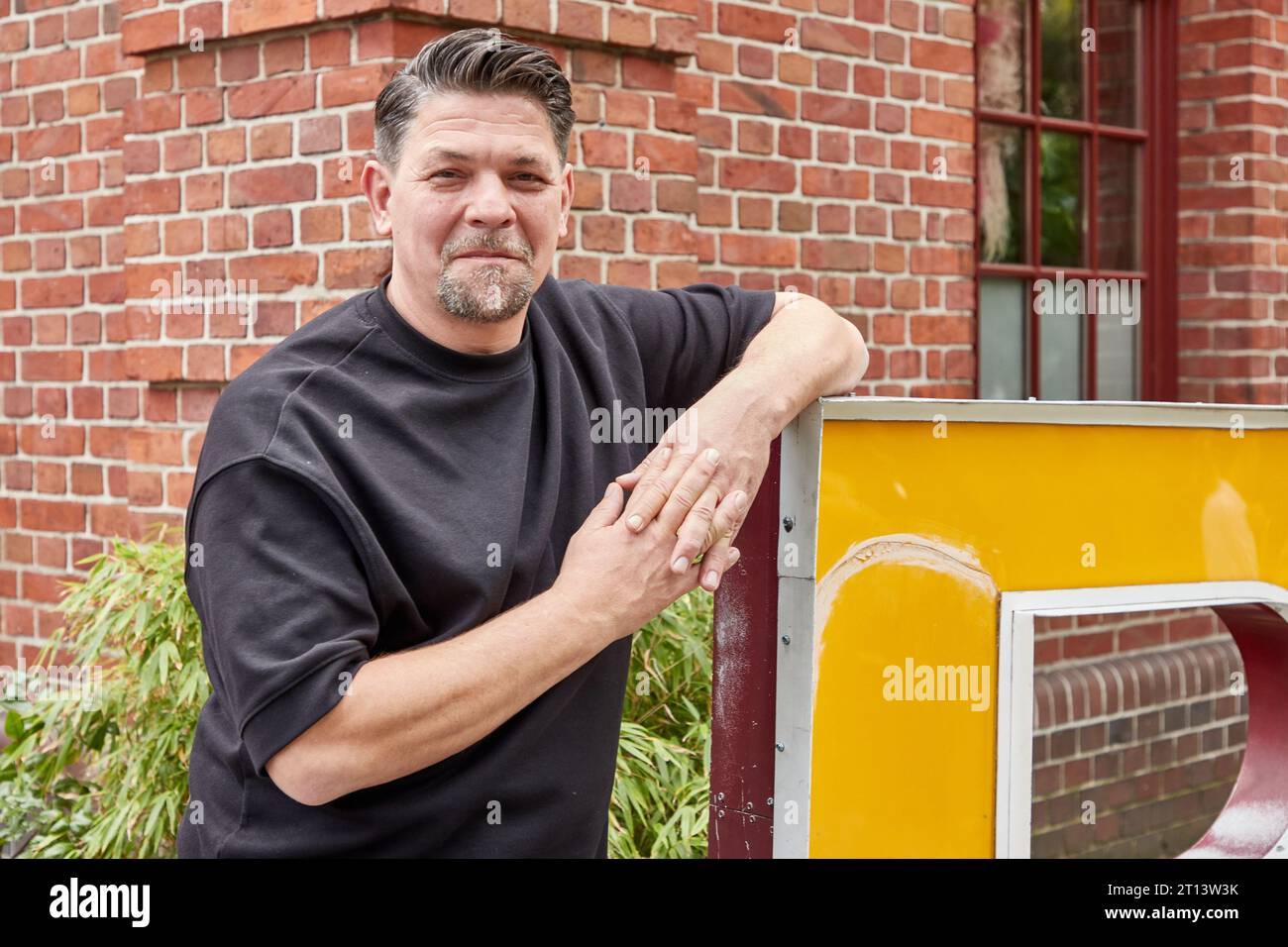 Hamburg, Germany. 18th Sep, 2023. Tim Mälzer, chef and author, stands in front of the restaurant 'Bullerei' on the occasion of an interview about his new book and the situation of pubs in Hamburg. (to dpa: 'Gastronome and TV chef Tim Mälzer: 'A cookbook should inspire') Credit: Georg Wendt/dpa/Alamy Live News Stock Photo