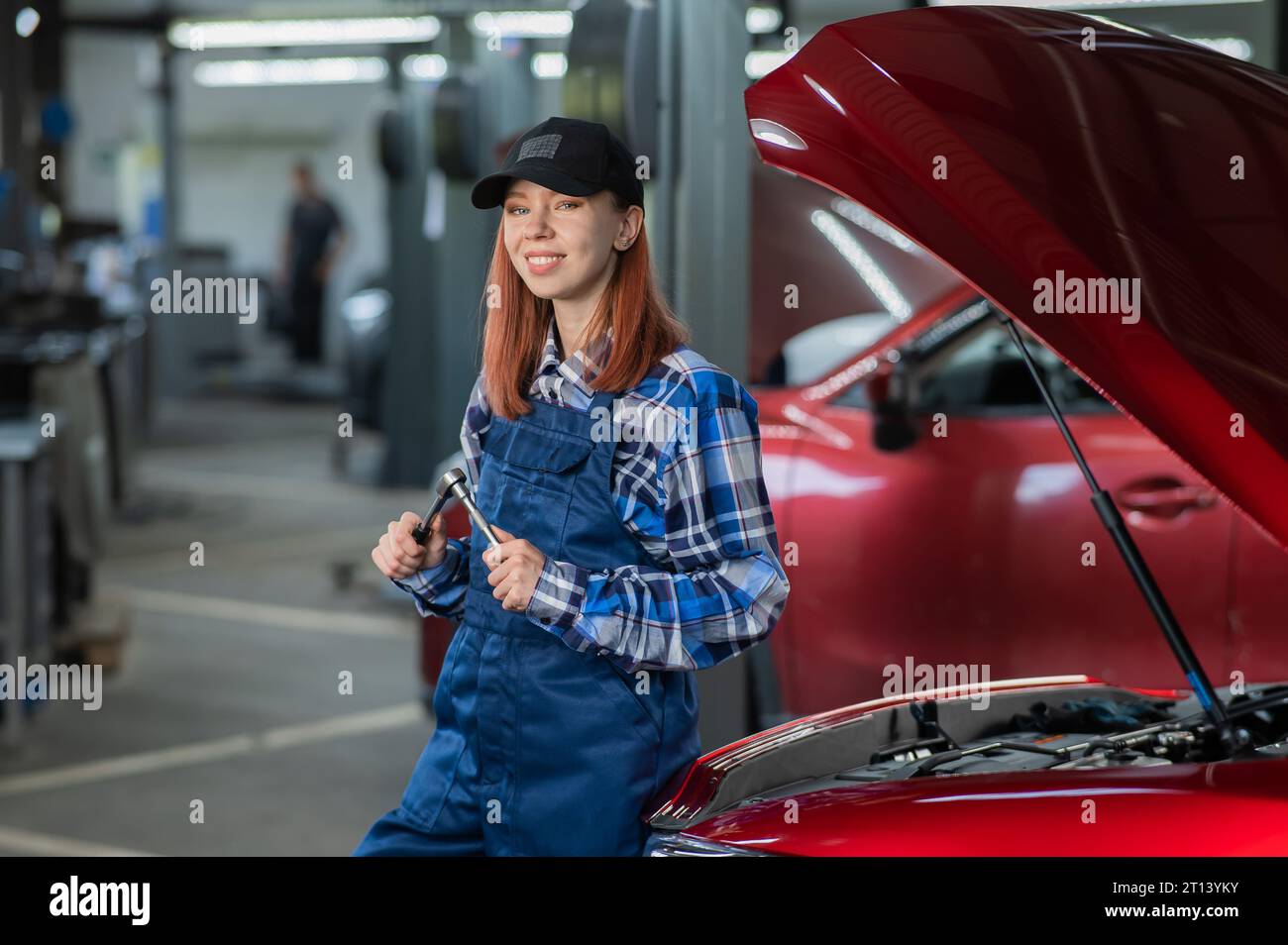 Woman auto mechanic stands hi-res stock photography and images - Alamy
