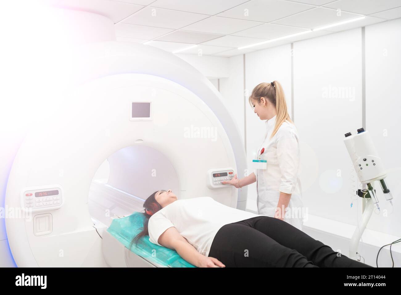 Female patient undergoing MRI - Magnetic resonance imaging in Hospital ...