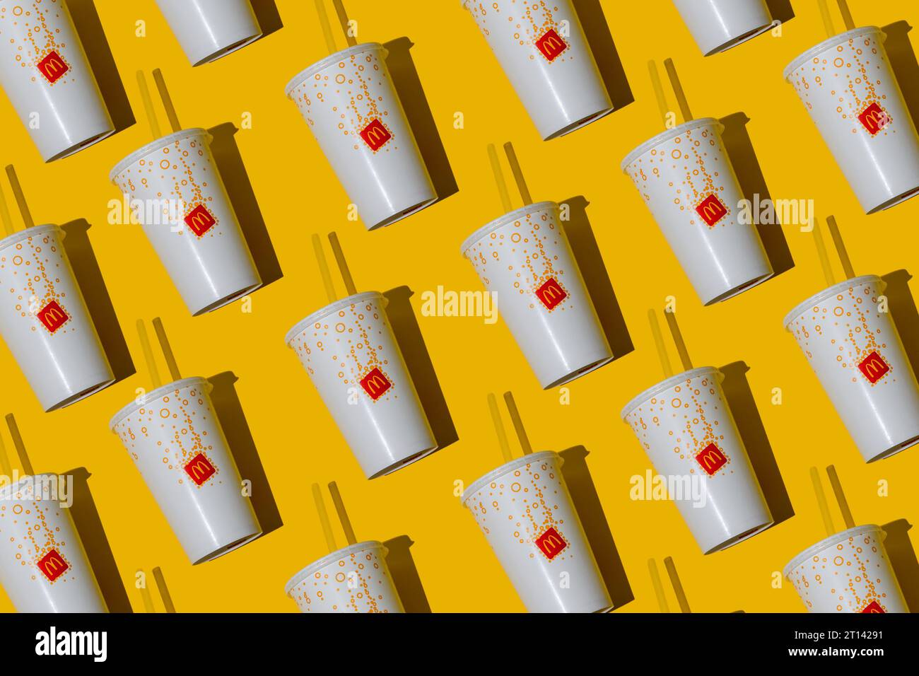 Yellow glass of McDonald's. Paper cup with lid. Takeaway drink ...