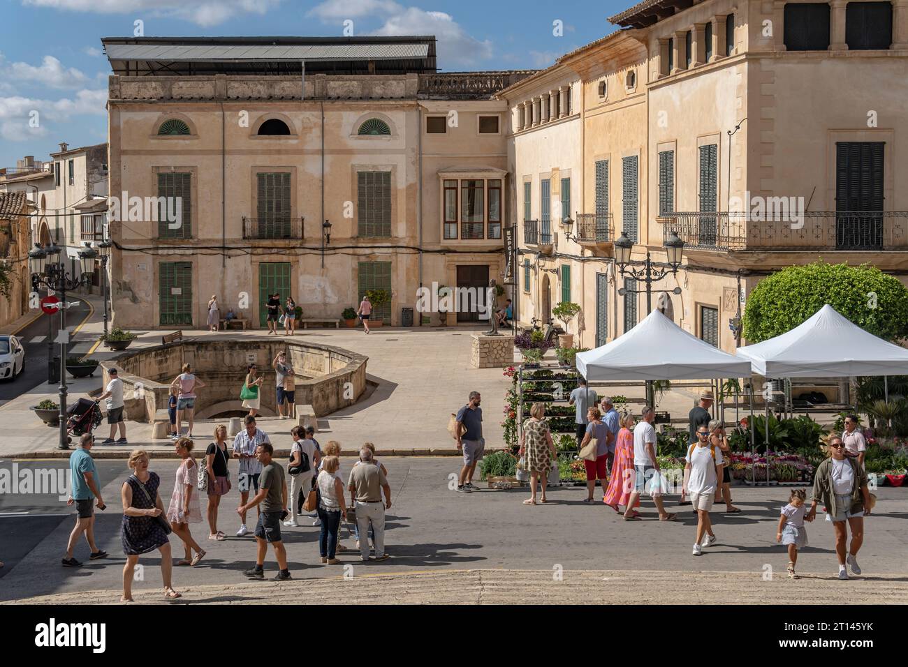 Felanitx, Spain; october 08 2023: Sunday weekly street market in the historic center of the Mallorcan town of Felanitx with tourists strolling around. Stock Photo
