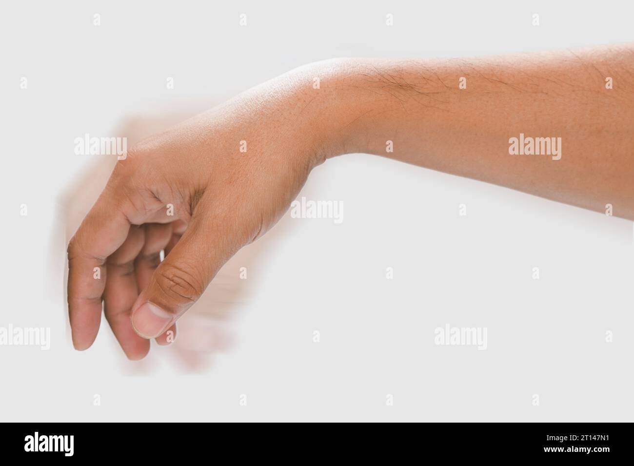The muscles the man's hand are twitching. Stock Photo
