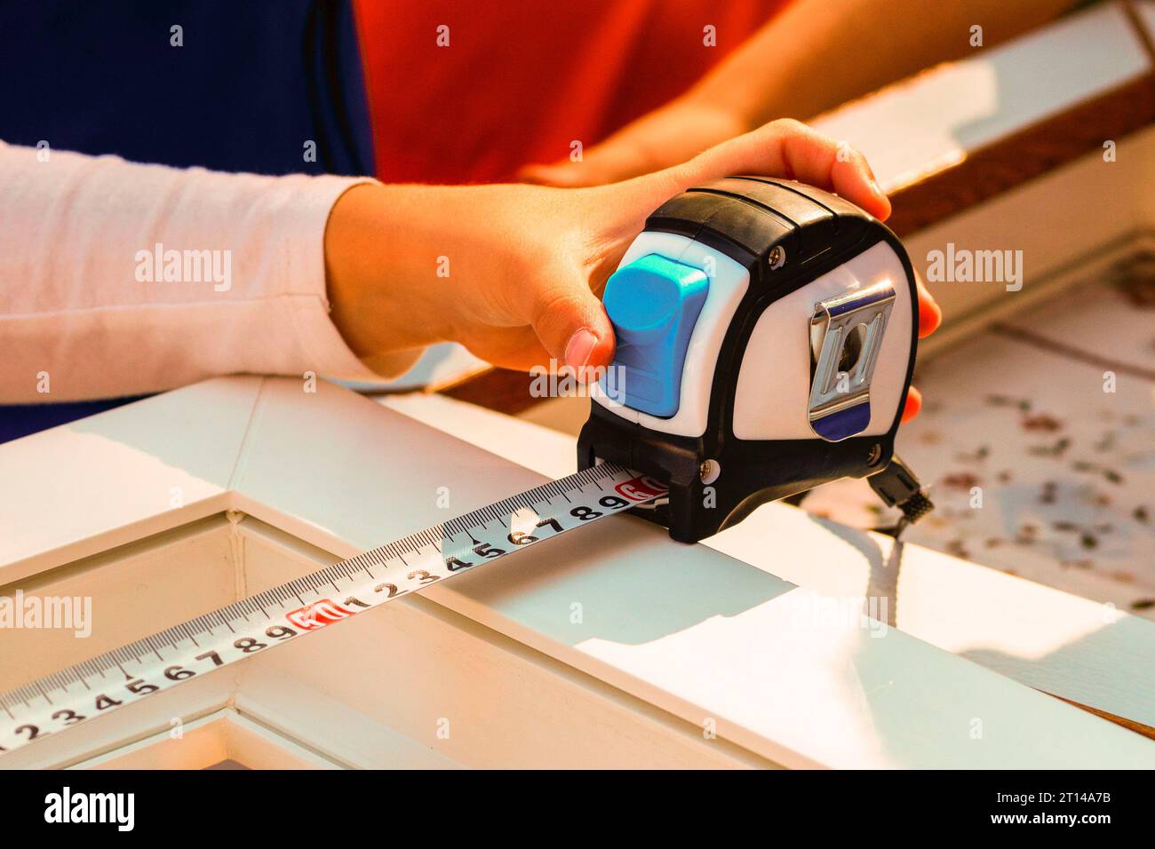 tapemeasure. Measurement of the size of a frame of a window tape