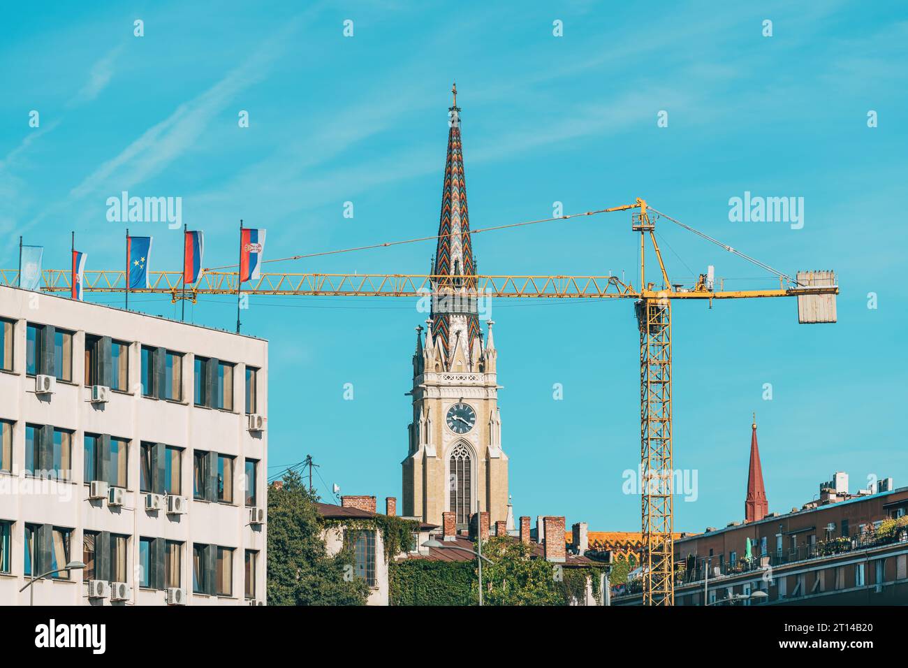 Novi Sad, Serbia - September 20, 2023: Construction crane in city center of Novi Sad where in recent years urbanisation is seen as a tool for economic Stock Photo