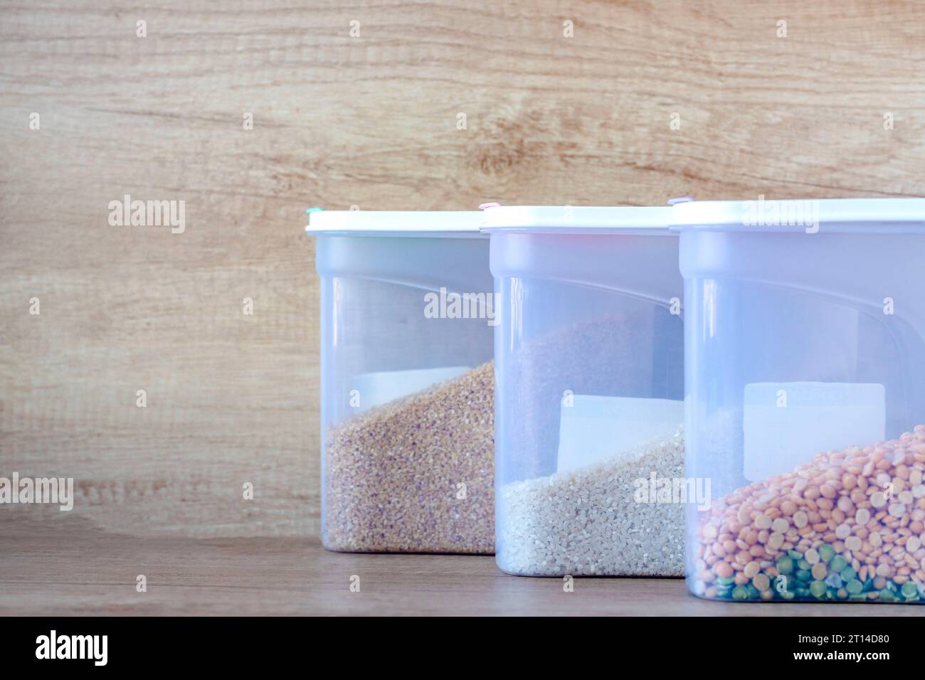 boxes of cereal of different types. Millet groats. plastic containers