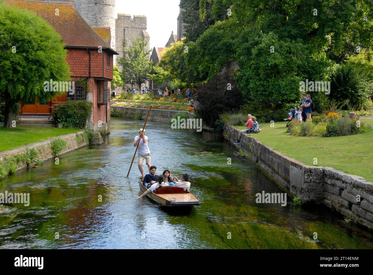 People traveling in a punt on the Great Stour river, Canterbury, Kent Stock Photo