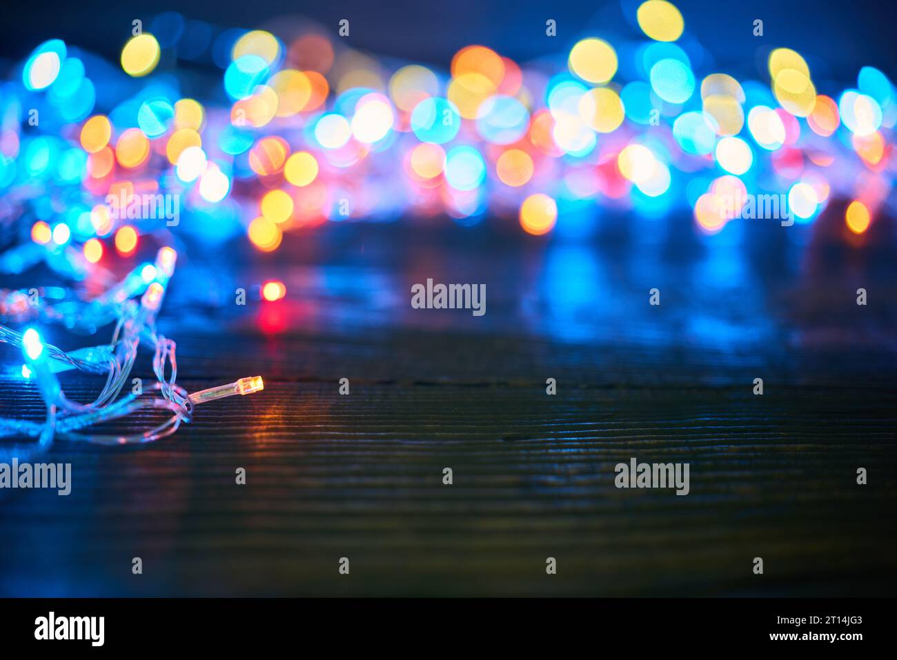 Colorful christmas lights background with copy space. Merry Christmas and Happy New Year festive composition Stock Photo