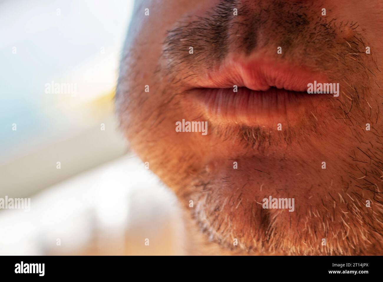 male mouth with unshaven stubble chewing bread behind the cheek Stock ...