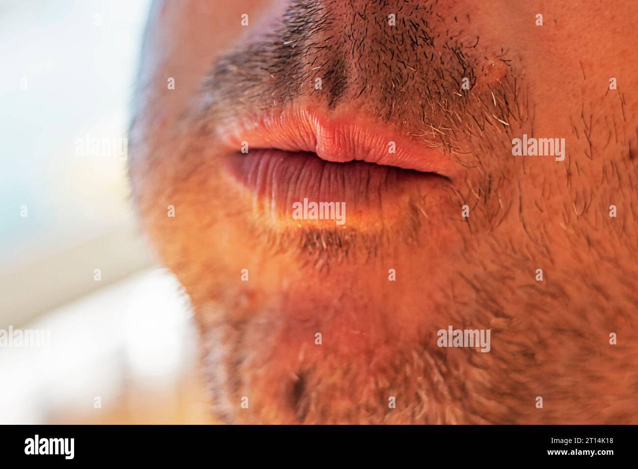 male mouth with unshaven stubble chewing bread Stock Photo - Alamy