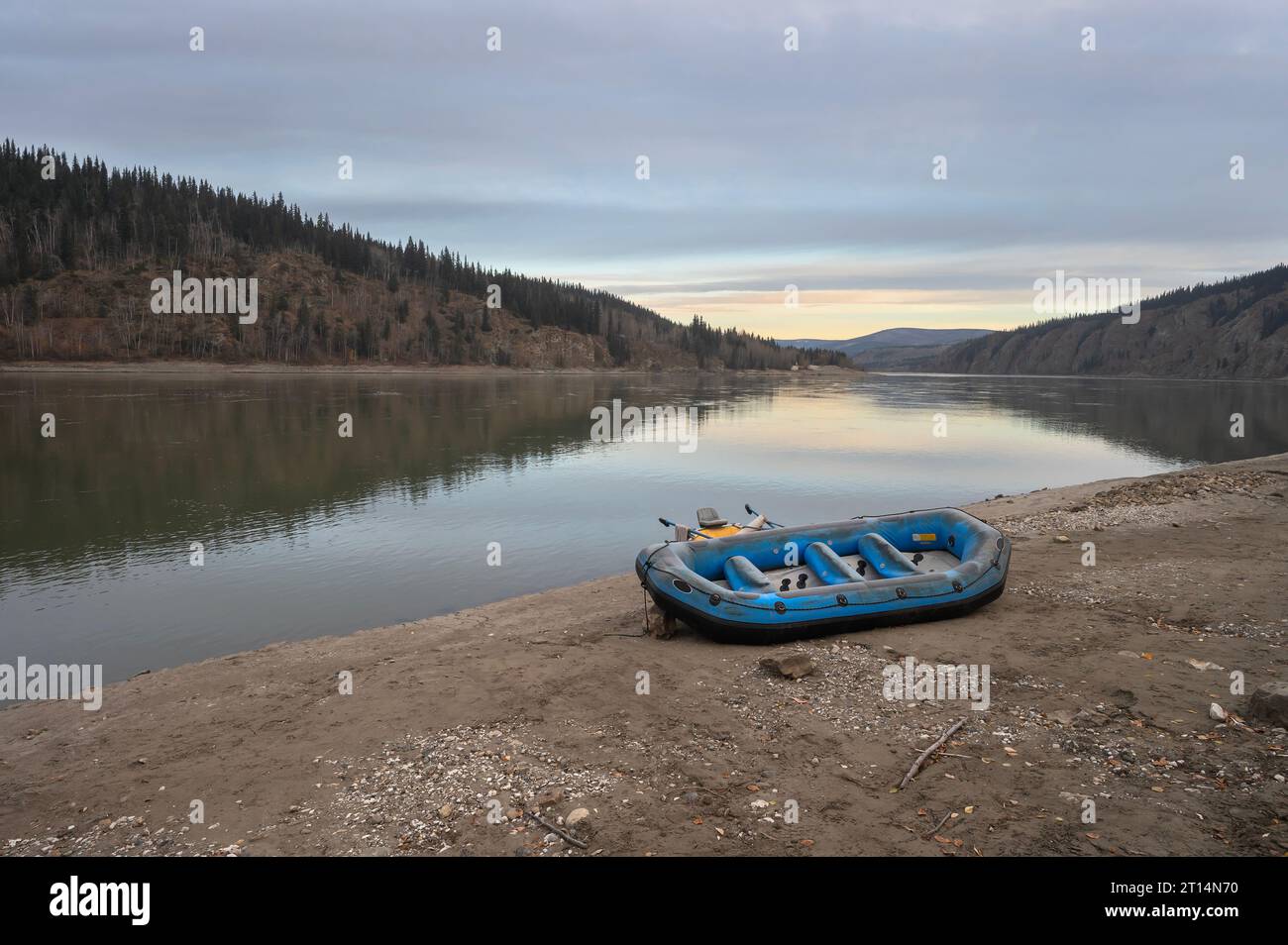 Morning view of an inflatable raft on the shore of the Yukon River at Dawson City, Yukon, Canada Stock Photo