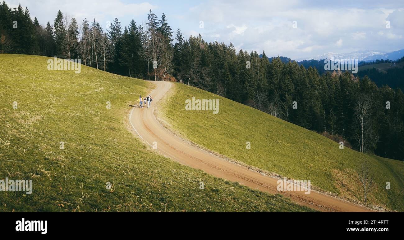 Caucasian family enjoy trekking day in the mountains - Travel and winter concept Stock Photo