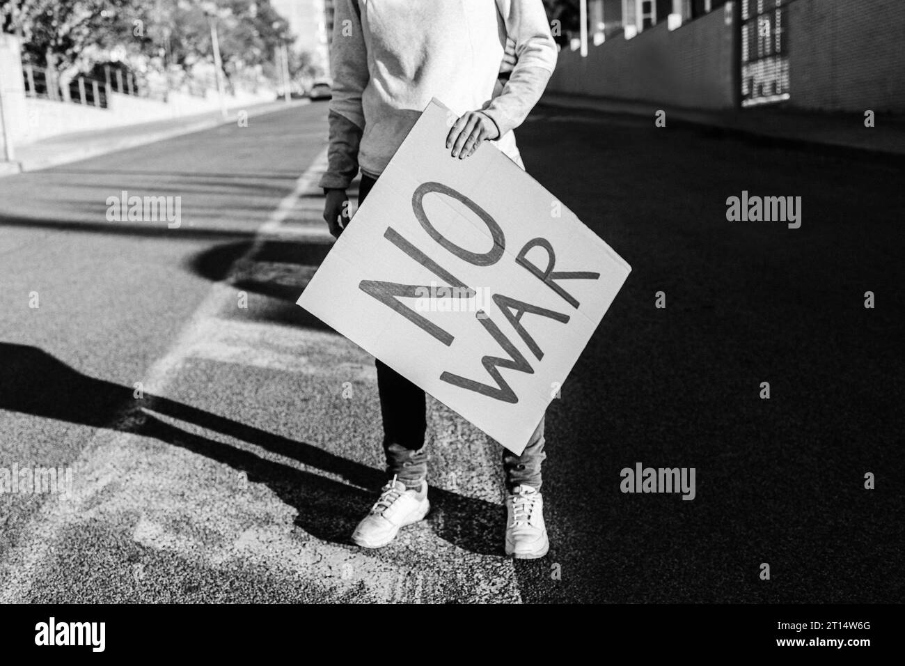 Stop war protest - People on street fighting for peace and human rights - Black and white editing Stock Photo