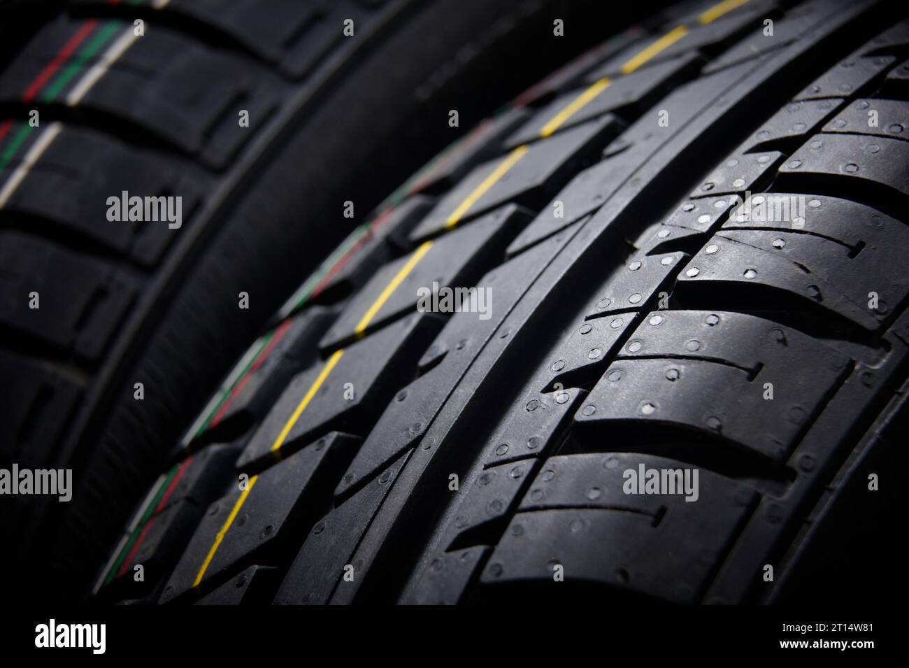Studio shot of a set of summer car tires on black background close up
