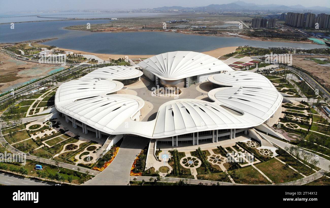 Qingdao. 22nd May, 2023. This aerial photo taken on May 22, 2023 shows the Qingdao SCODA Pearl International Expo Center in the China-SCO Local Economic and Trade Cooperation Demonstration Area (SCODA) in Qingdao, east China's Shandong Province. Credit: Li Ziheng/Xinhua/Alamy Live News Stock Photo