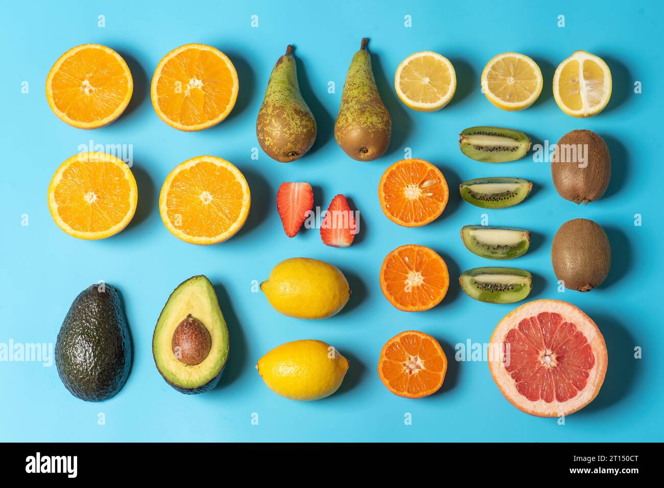 Colorful fruit juicy pattern on light blue background made of fresh