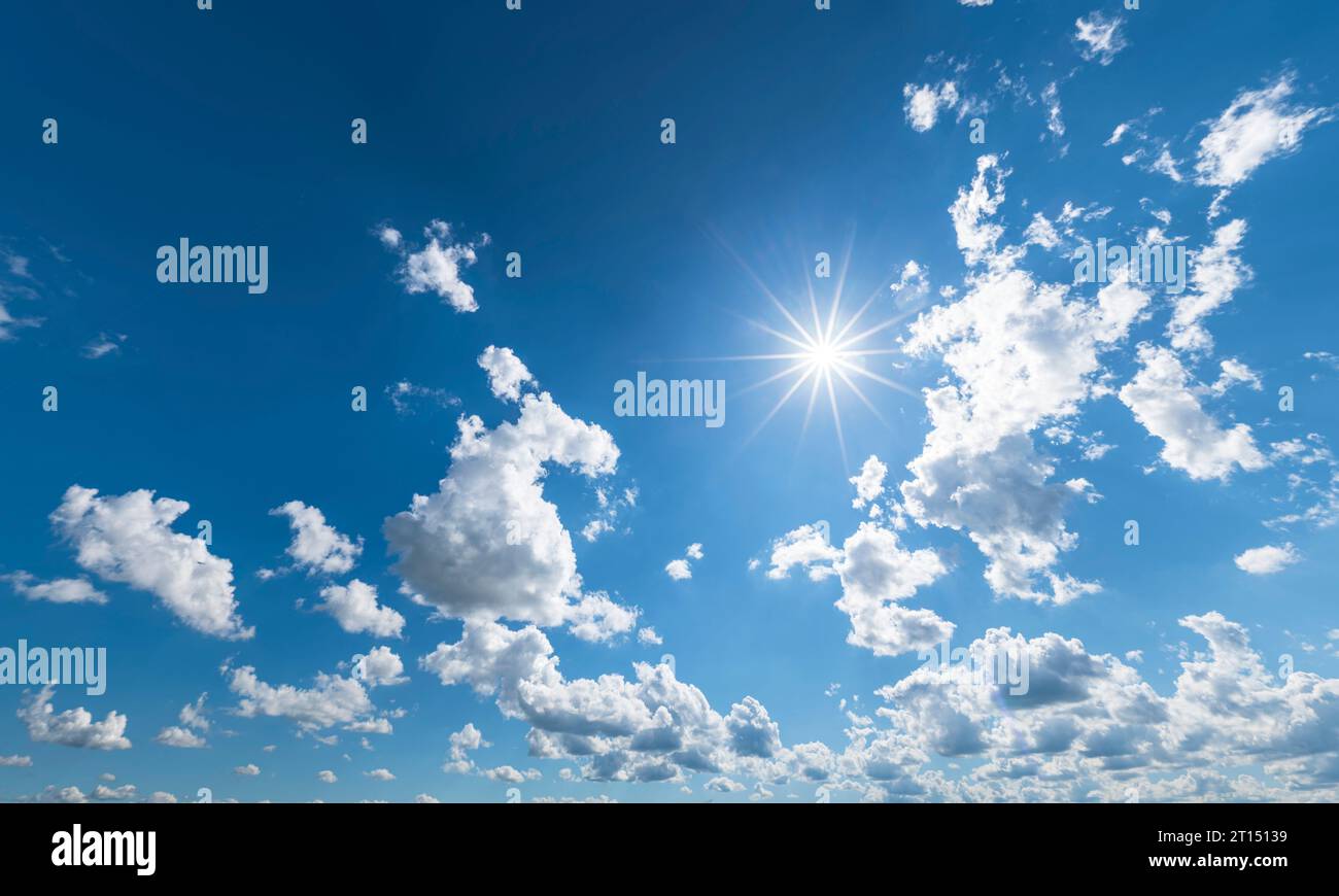Fluffy white cumulus clouds in the blue sky Stock Photo - Alamy