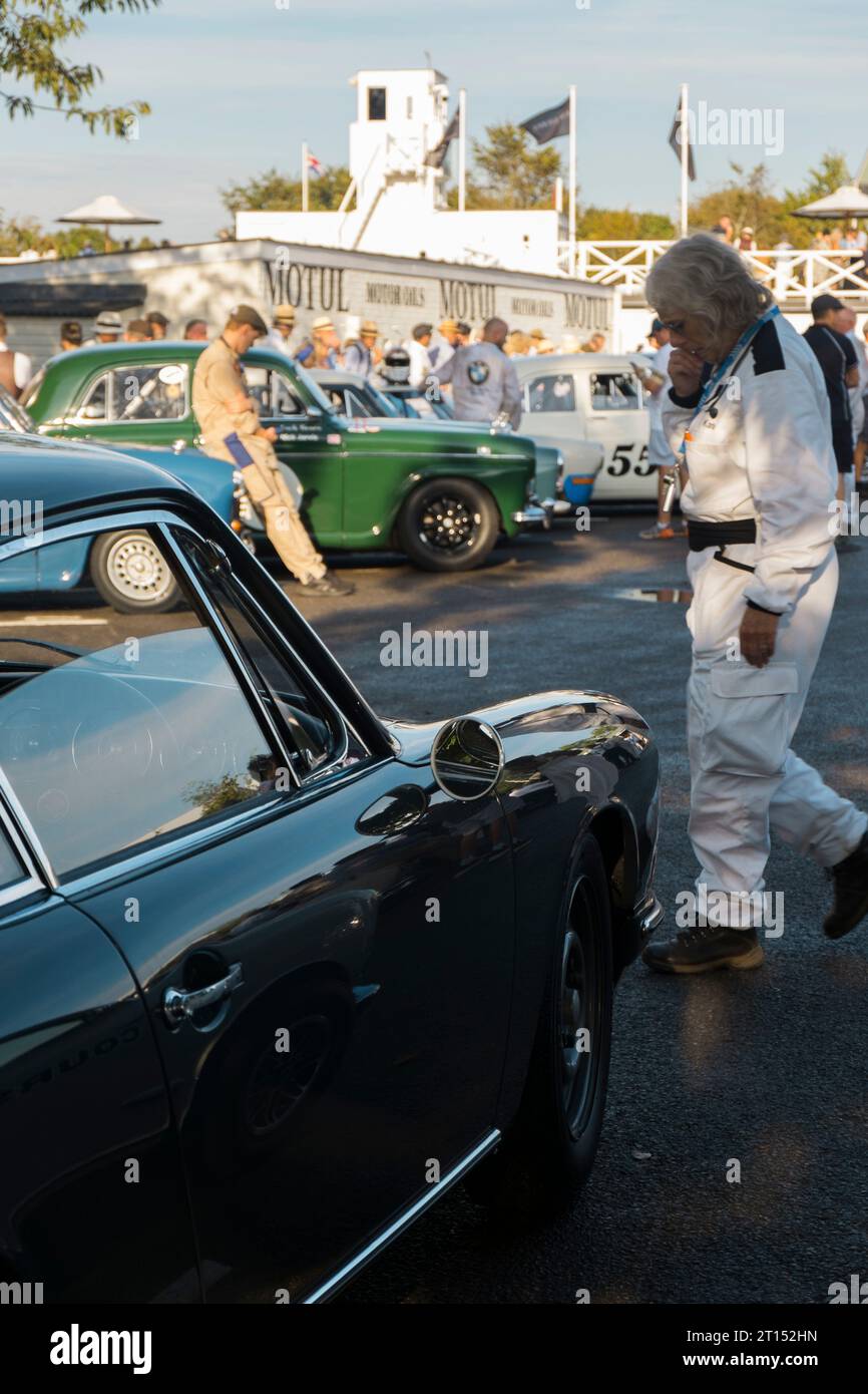 Mechanic & drivers in the Assembly Area with 1950s saloon cars before ...