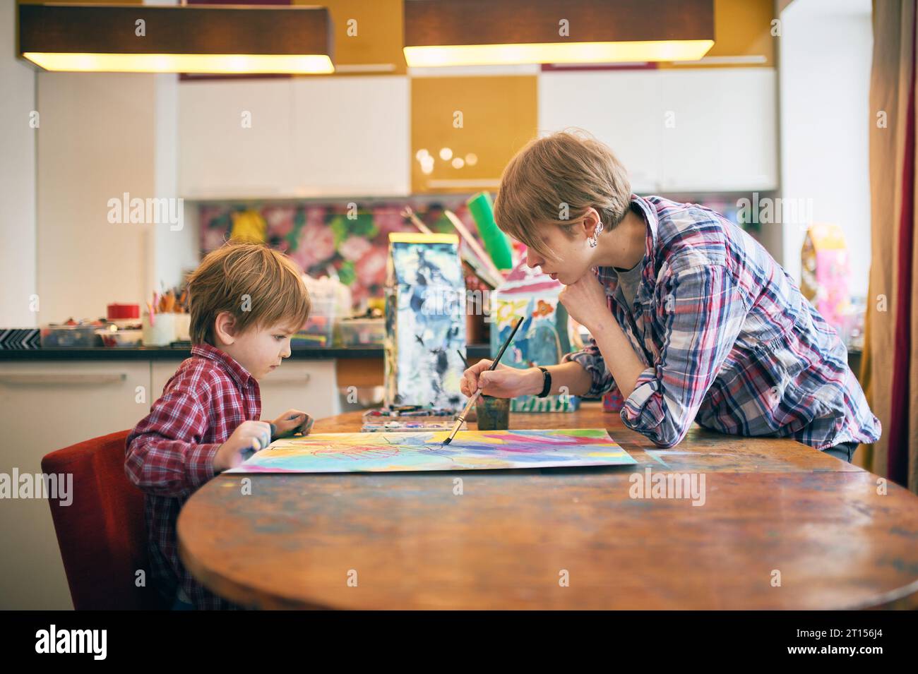 Cute happy little boy and teacher drawing in artist class. Education ...