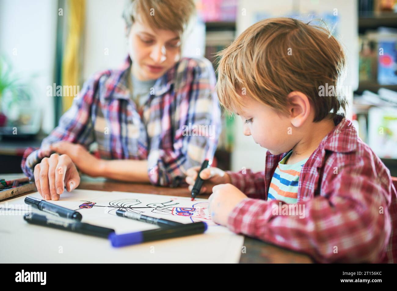 Cute happy little boy and teacher drawing in artist class. Education ...