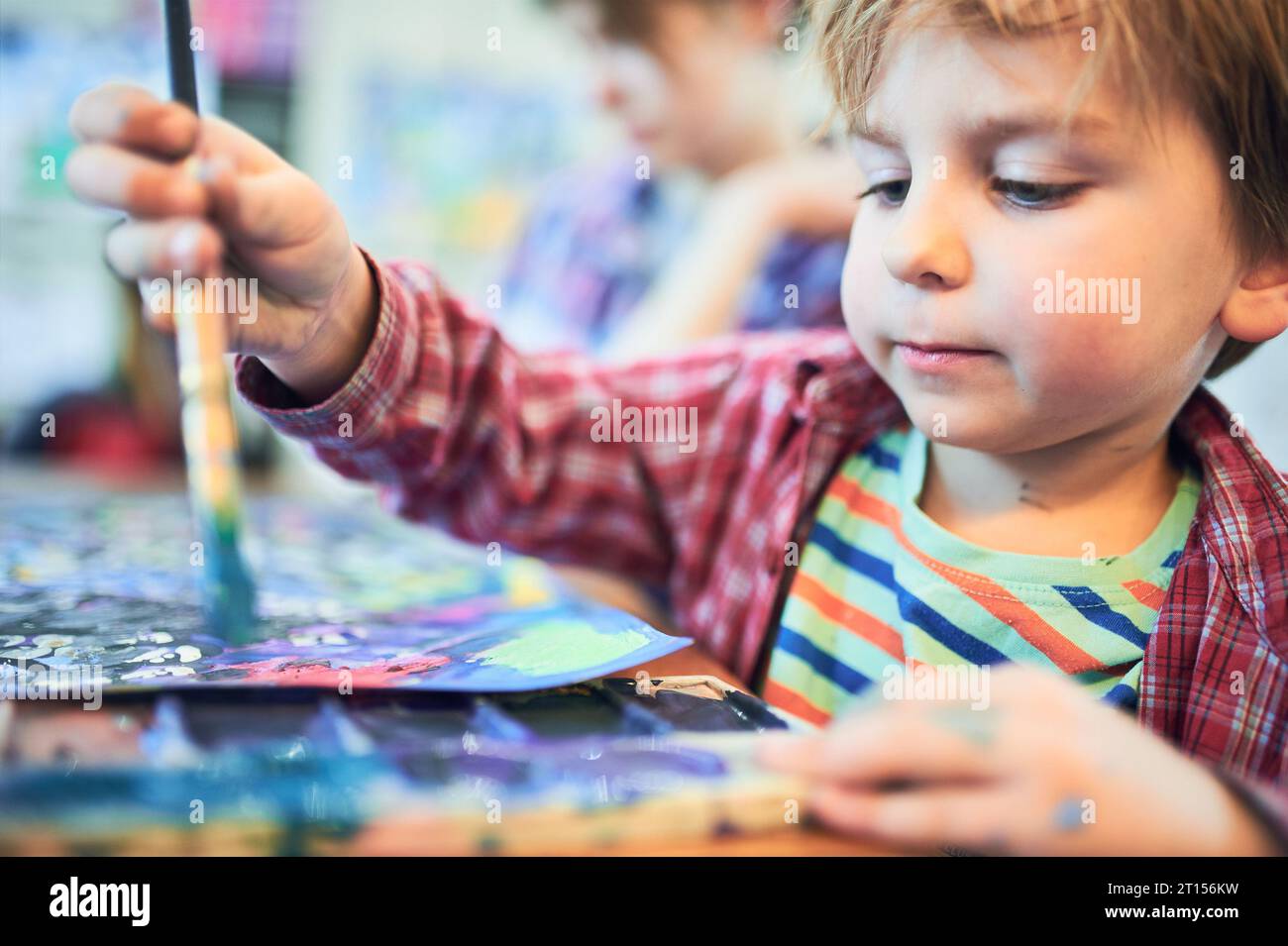 Cute happy little boy and teacher drawing in artist class. Education ...