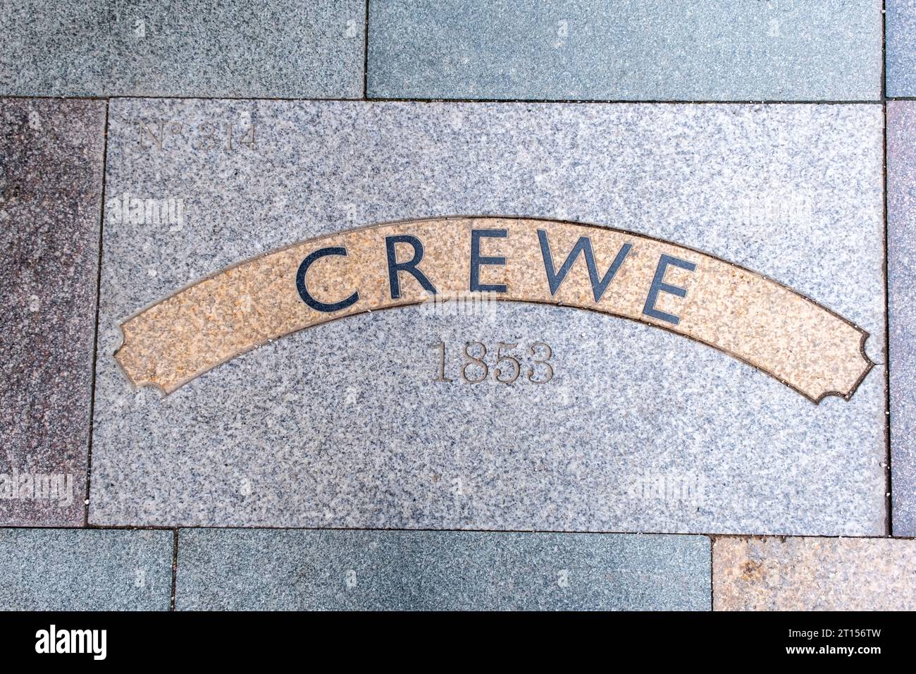 Paving slab in West Street Crewe saying Crewe, train build at Crewe Works No 314 in 1853 Stock Photo