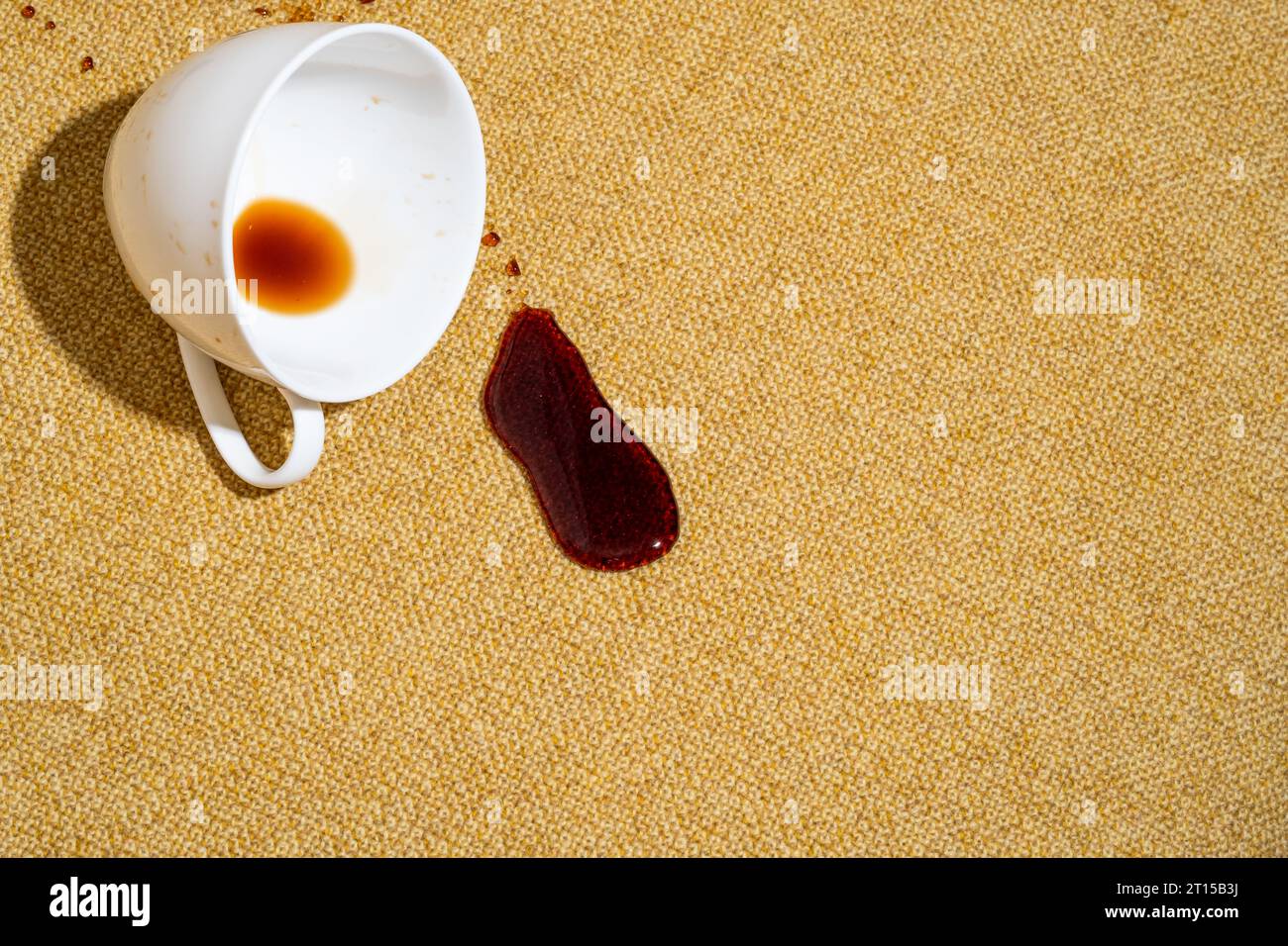 Spilled coffee on a yellow sofa, carpet or upholstery. Spoiled fabric