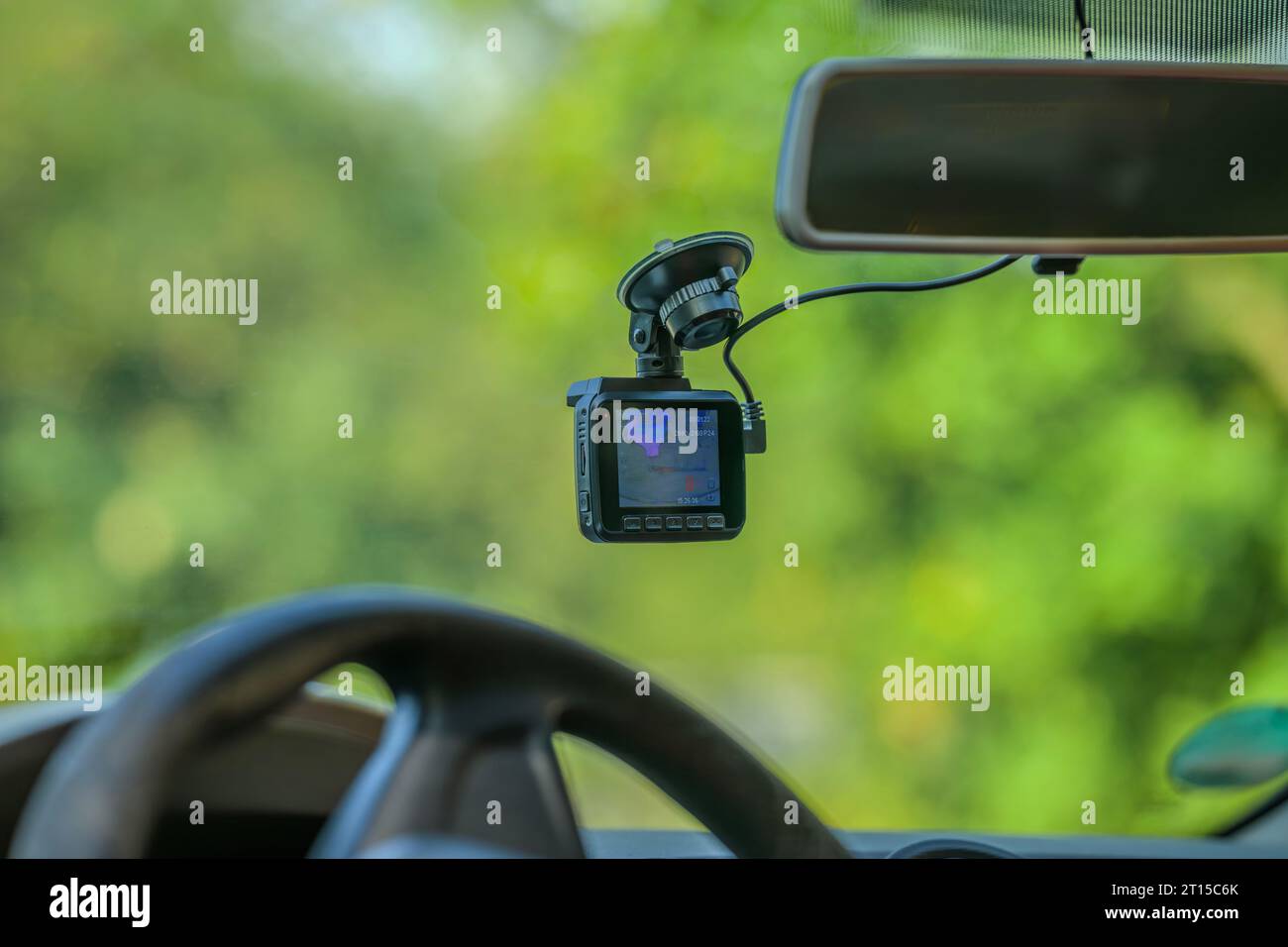 A dashcam on the windshield of a car Stock Photo