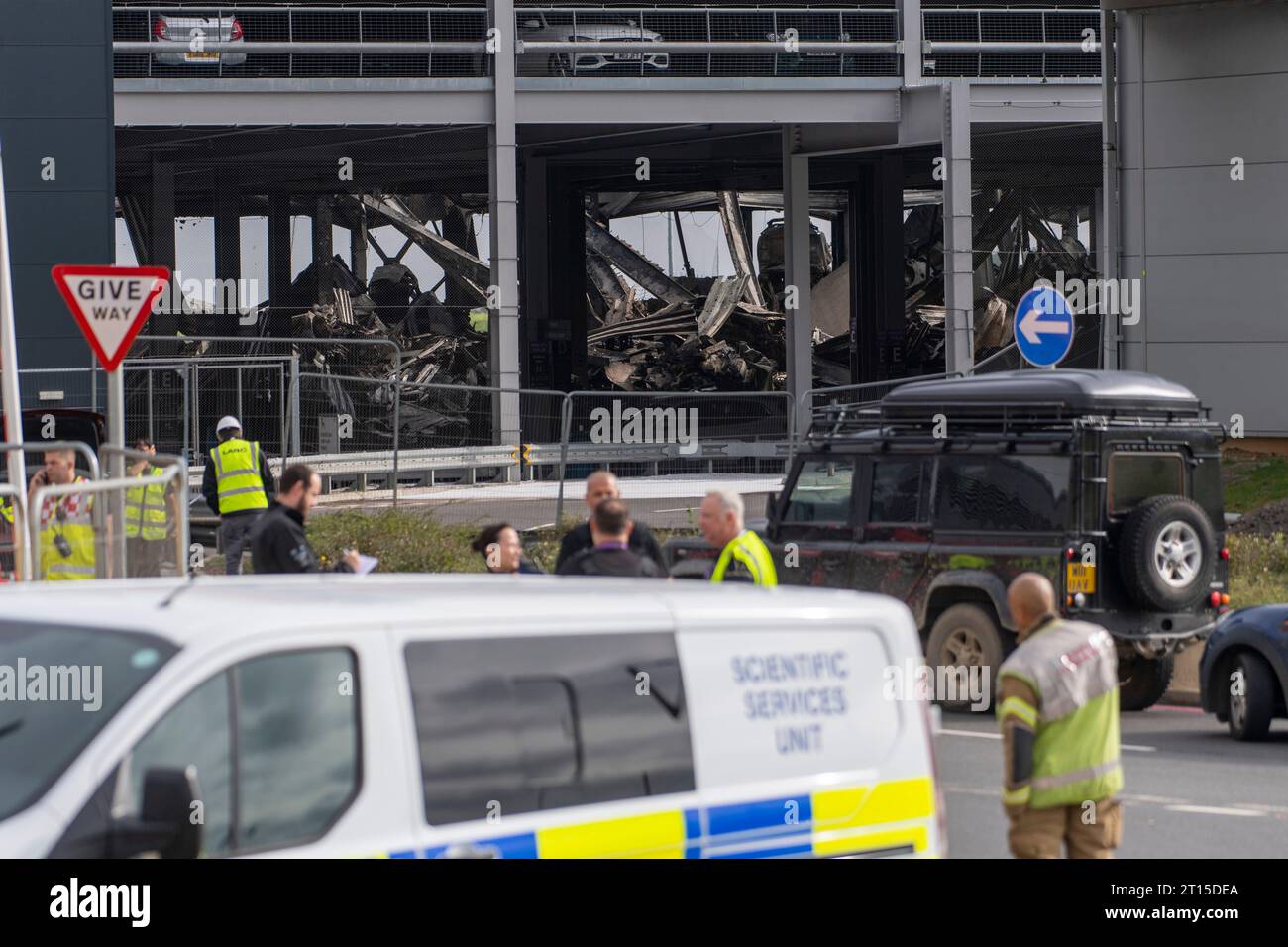 London, UK. 11th Oct, 2023. Fire crew members inspect the damage caused