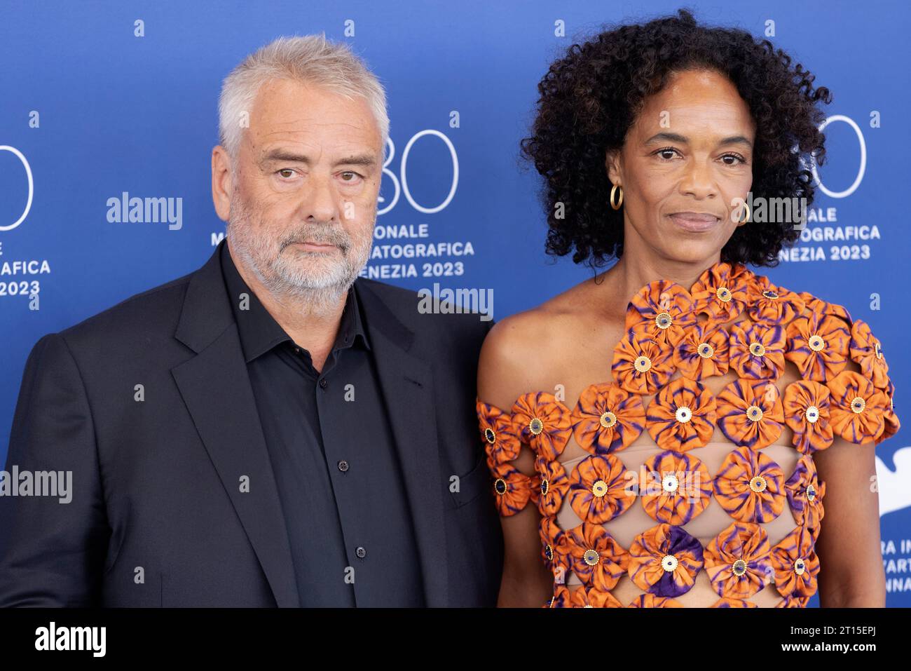 VENICE, ITALY - SEPTEMBER 08: Director Luc Besson and Virginie Besson-Silla attend the photo-call for the movie ÒDogmanÓ at the 80th Venice Internatio Stock Photo