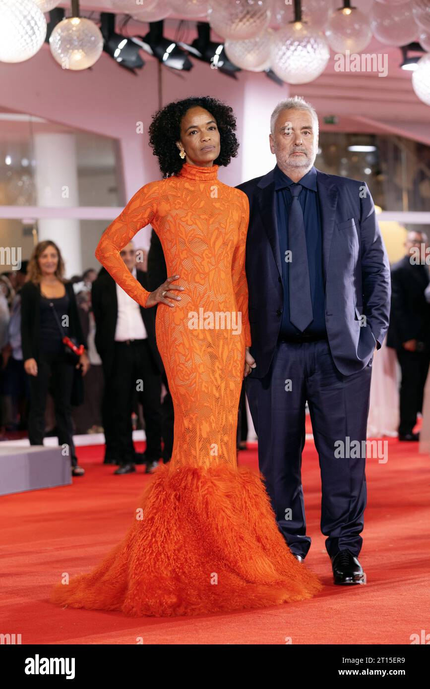 VENICE, ITALY - SEPTEMBER 08: Director Luc Besson and Virginie Besson-Silla attend the red carpet for the movie ÒDogmanÓ at the 80th Venice Internatio Stock Photo