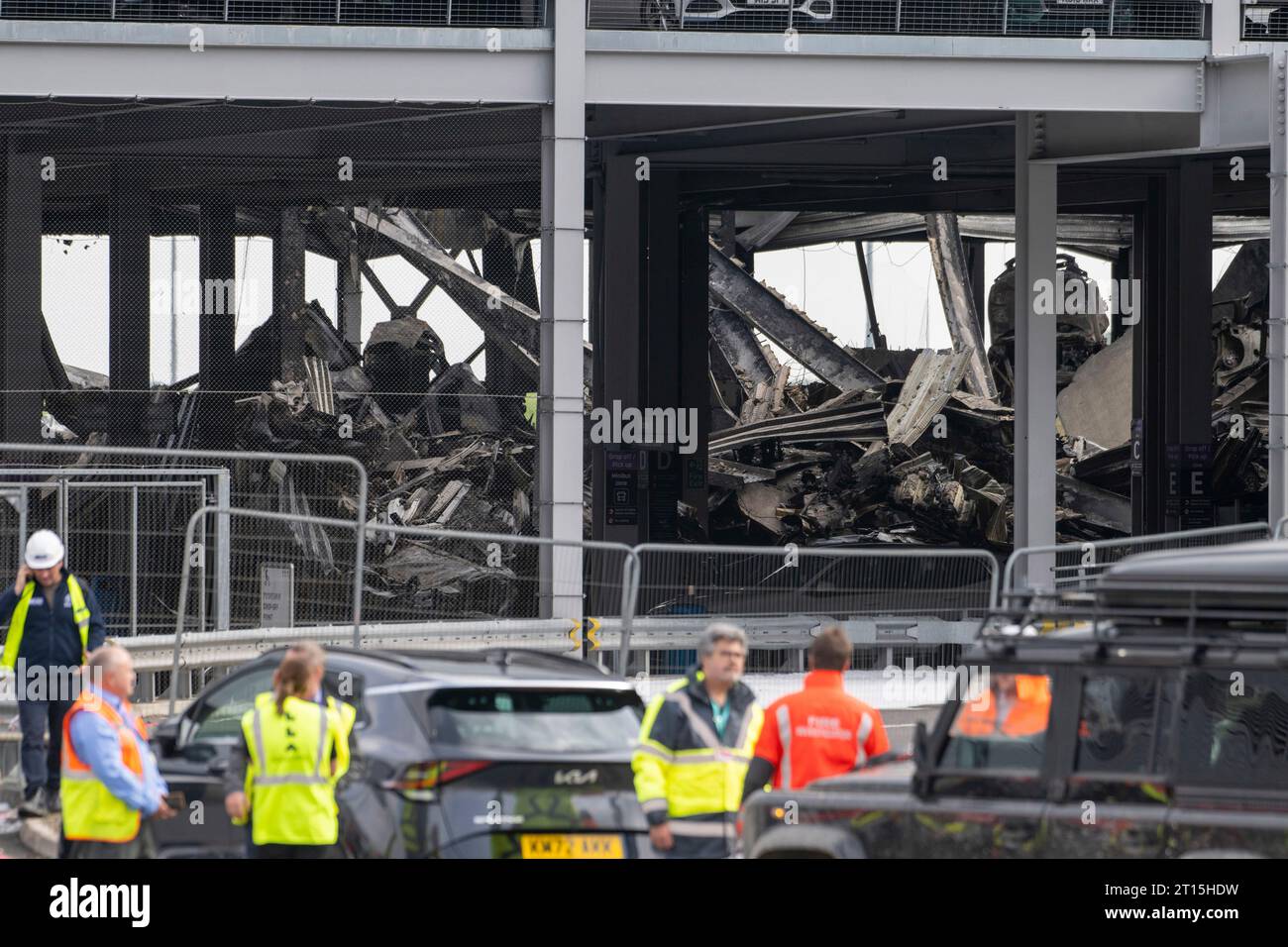 London, UK. 11th Oct, 2023. Fire crew members inspect the damage caused