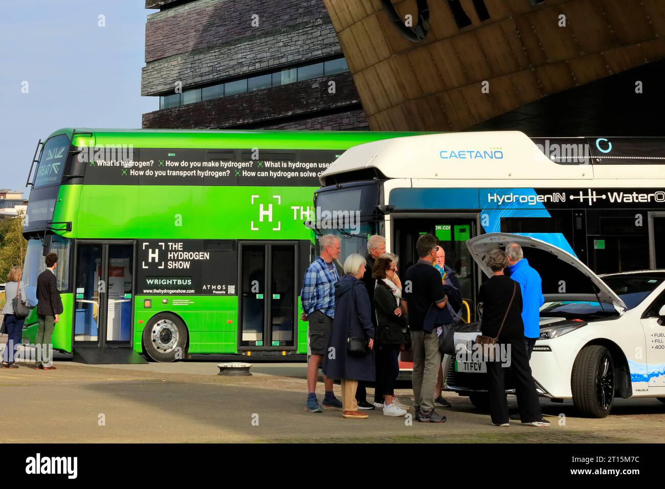 Buses and cars at an event for promoting Hydrogen Powered Vehicles with zero emissions outside The Millennium Centre, Cardiff Bay. October 2023. Stock Photo