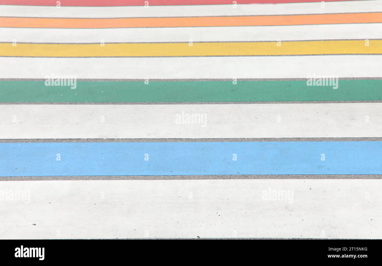 colorful pedestrian crossings for pedestrians to cross on the asphalt road Stock Photo