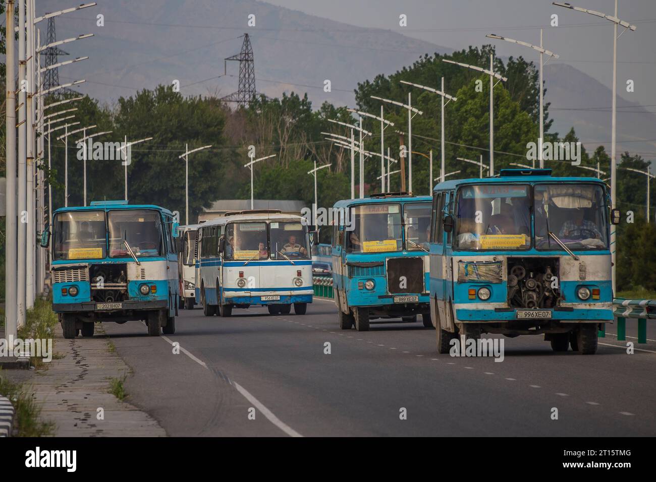 28.04.2022. Tajikistan, Tursunzoda bypass. Fleet of service buses serving TALCO - Tajik Aluminium Company. Stock Photo