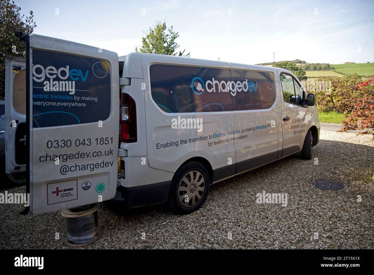 Charged EV van carrying out installation of Indra v2h charger making charging simple for everyone everywhere UK Stock Photo