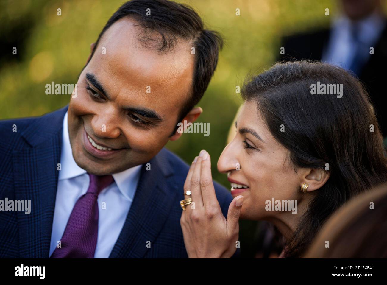 Washington, United States. 11th Oct, 2023. Lina Khan (right), Chair of the Federal Trade Commission (FTC), whispers to Rohit Chopra (left), Director of the Consumer Financial Protection Bureau (CFPB), following remarks by President Joe Biden in the Rose Garden at the White House on Wednesday, October 11, 2023 in Washington, DC The President is announcing new actions that the administration is taking to protect consumers from hidden junk fees. Photo by Samuel Corum/UPI Credit: UPI/Alamy Live News Stock Photo