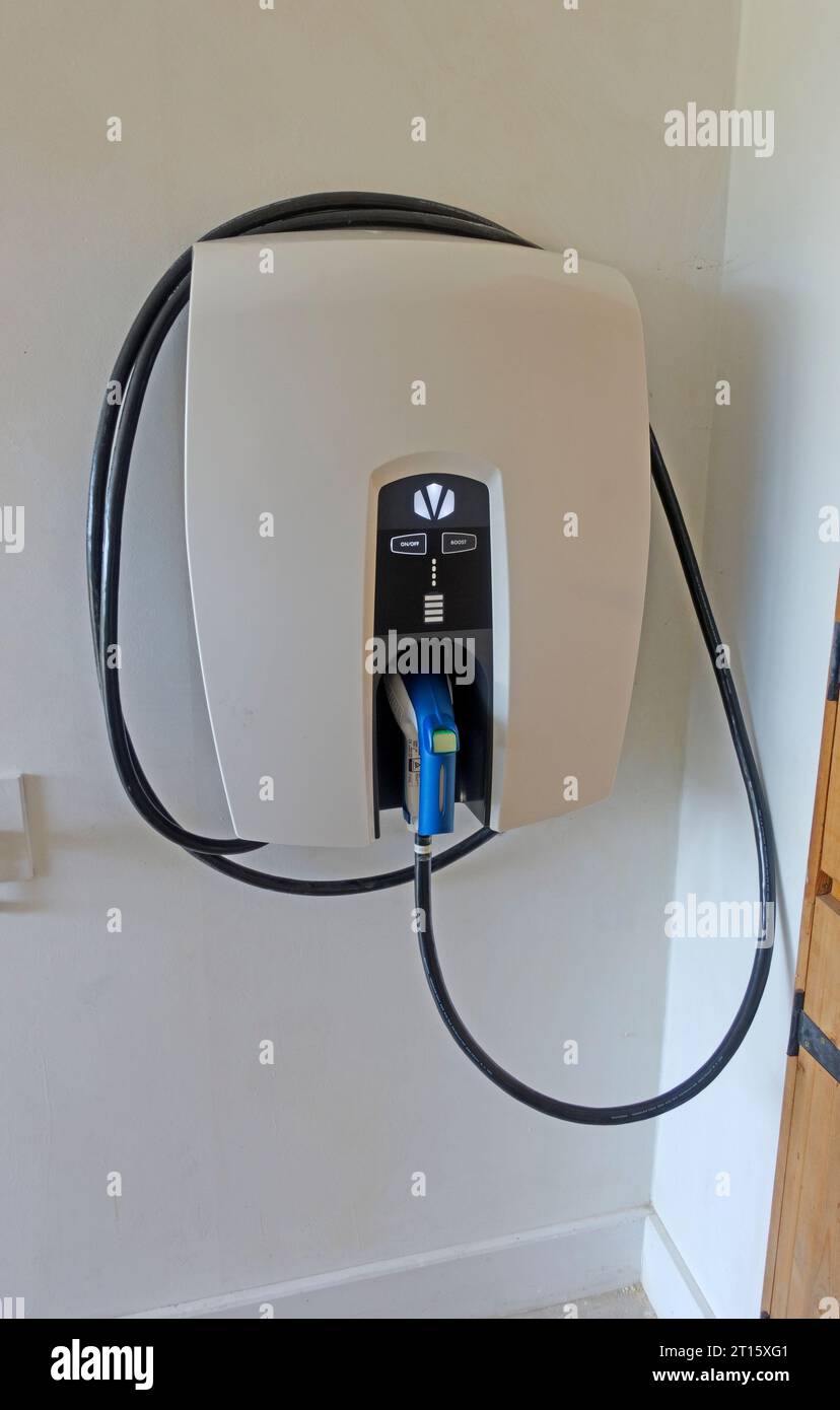 Revolutionary new Indra v2h bidirectional  vehicle to home electric vehicle charger enables charging of electric vehicle or supplying power to the hou Stock Photo