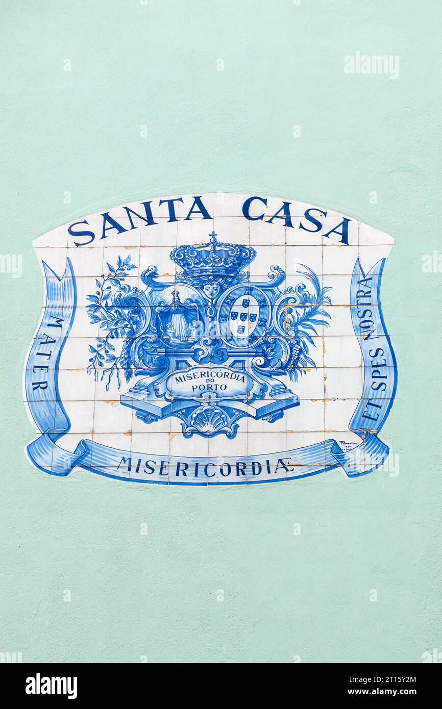 Sign made with tiles in the facade of the Santa Casa. The images has a ...