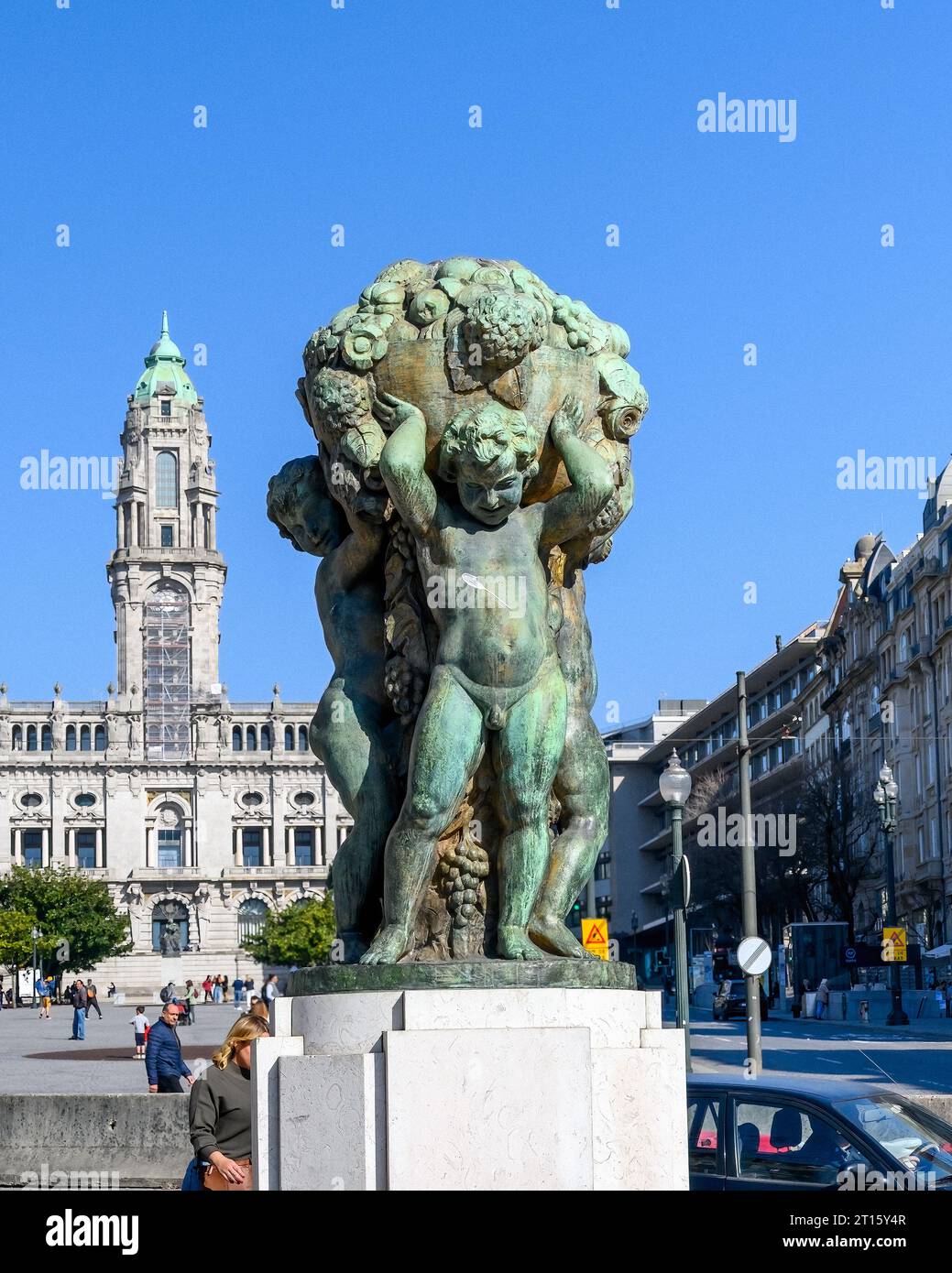 A statue or sculpture named 'The Boys - The Abundance' by Henrique Moreira. The famous work of art is located in the Avenida dos Aliados Stock Photo