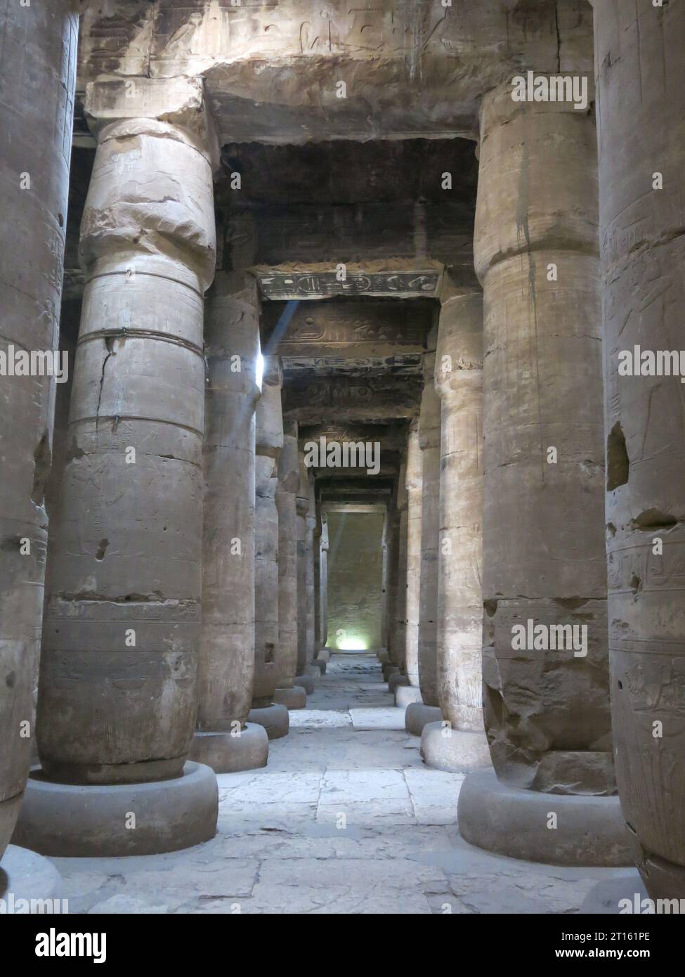 Tall stone pillars in the the hypostyle hall at the Great Temple of Seti I at the sacred city of Abydos, from the times of Ancient Egypt. Stock Photo