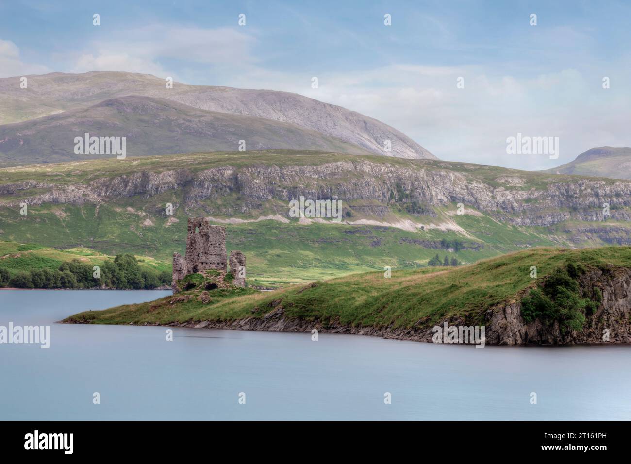 The ruins of Ardvreck Castle and Calda House at the shore of Loch